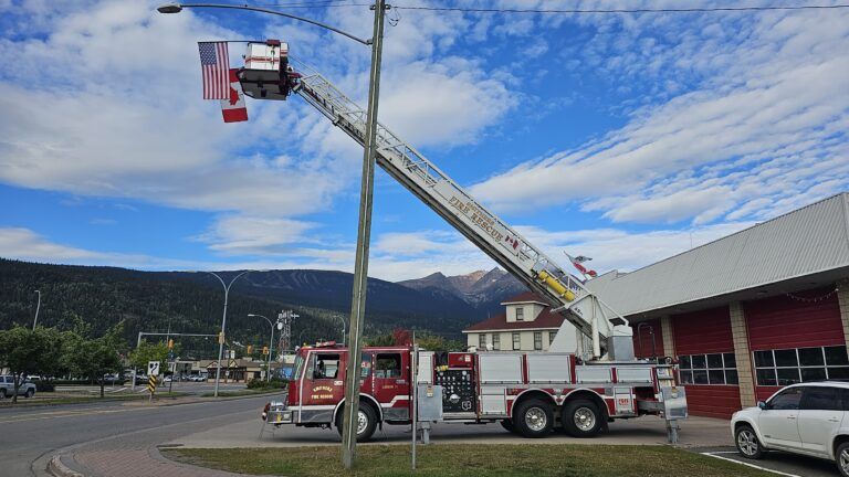 Canadian and American flags flown at Smithers Fire Hall