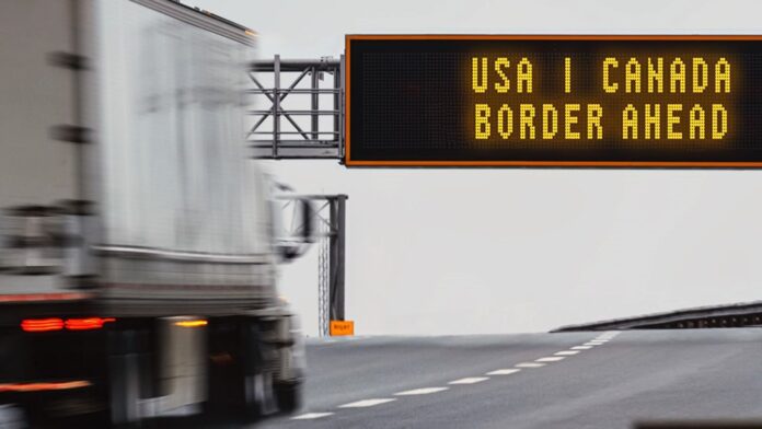 FILE - A semi-trailer approaches the Canada-U.S. border in this photo illustration. | Economic Development Canada photo